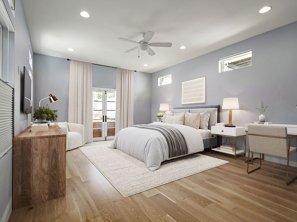 This rare oversized primary bedroom has soaring 10' ceilings and tons of light.  A roomy respite overlooking the gorgeous pool-Virtually Staged