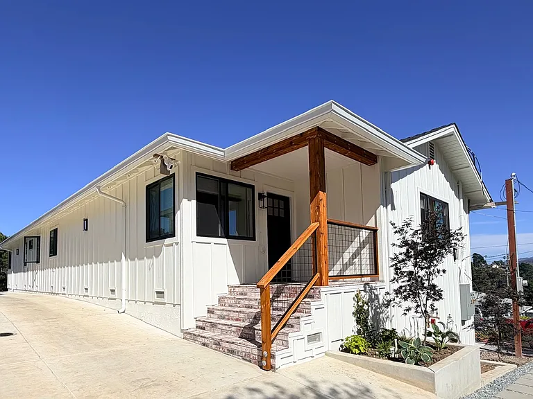 Beautiful remodeled home with modern farmhouse-inspired design and inviting front entry.