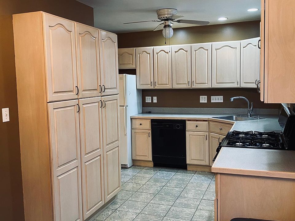 Kitchen with dining area. Abundant cabinets. Base cabinets have pull out shelves/drawers for easy access to stored items.