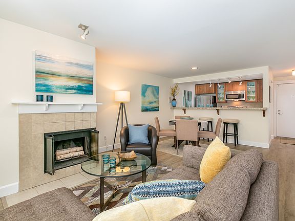 Open-concept living and dining space with warm, inviting finishes