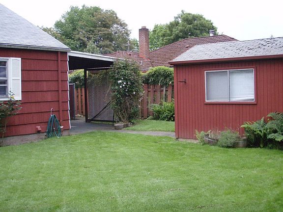 Back of house w/ patio and shed