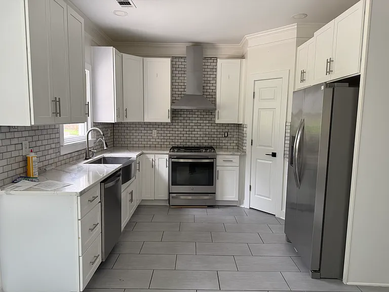 Quartz countertop, sterling appliances, and pantry closet.