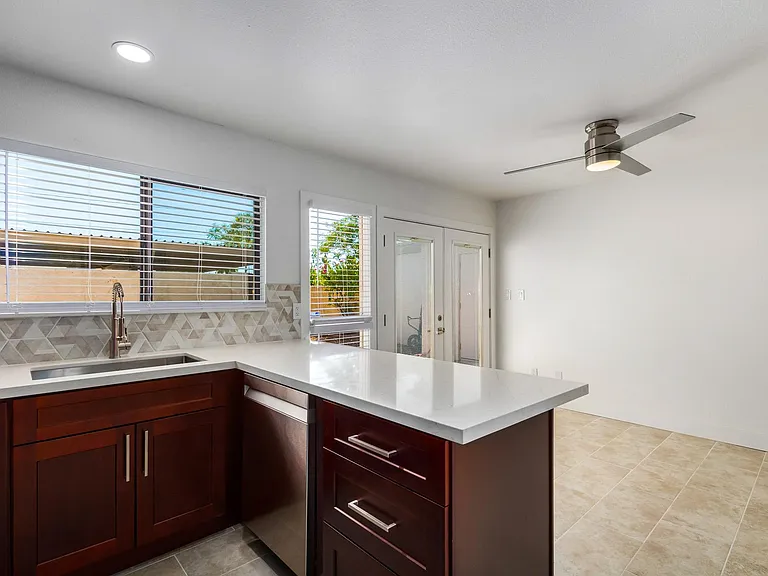 Kitchen with French doors leading to outdoor living space