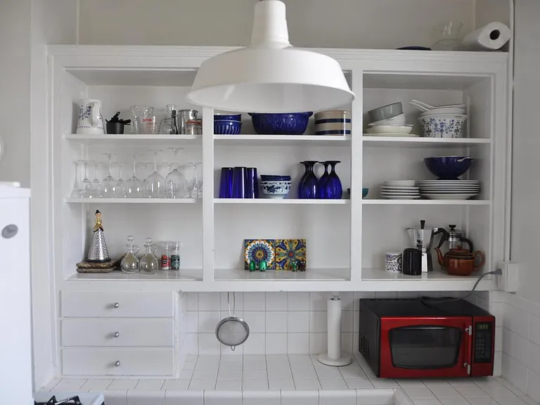 Potential kitchen shelves layout. Microwave currently not included, but landlord will provide if desired.