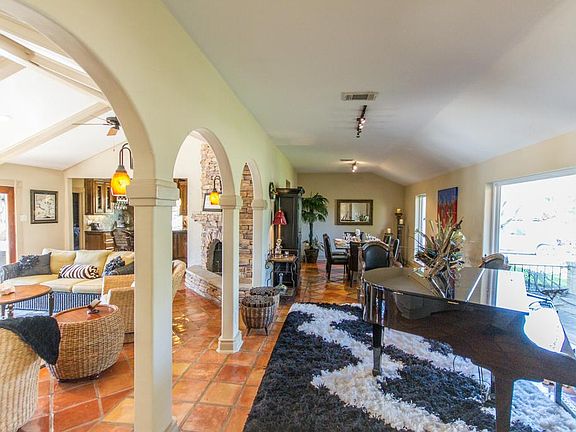 Homeowners raised the once sunken music and dining room floors and added title.