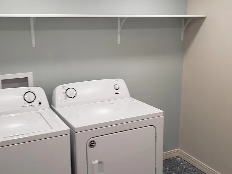 private laundry room with storage (view #2).