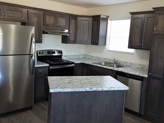 Kitchen w/ dishwasher, refrigerator w/ ice maker, electric range and garbage disposal