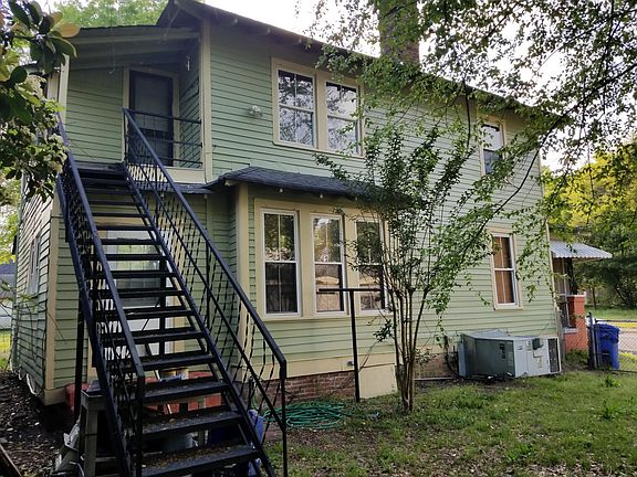 East upstairs porch w/outside stairway.
