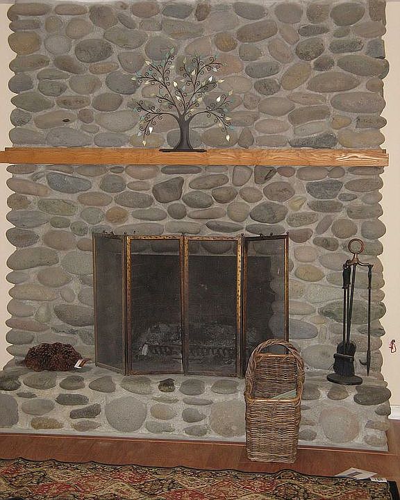 Upstairs river rock fireplace