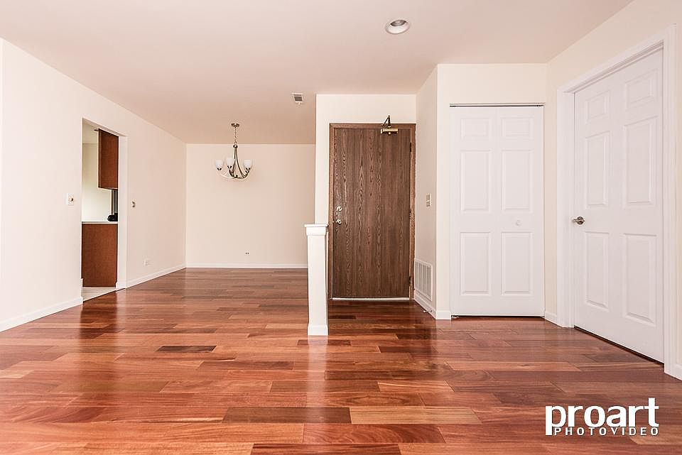 Front door to unit, dining room to left