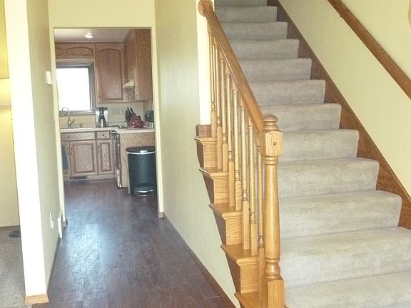 enter a LG foyer w/open stair.
