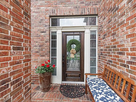An inviting front porch greets guests as they arrive.