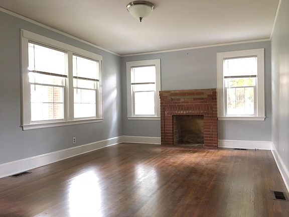 Large living room with wood burning fire place