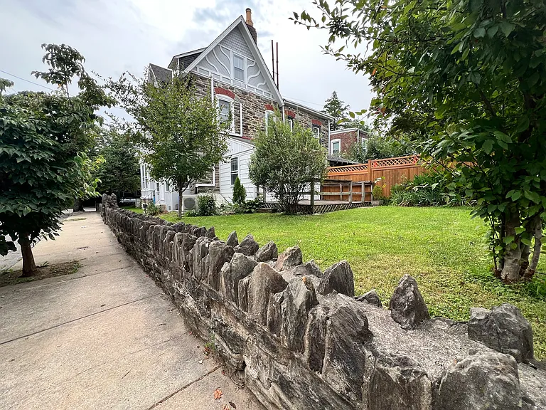 Side wall containing the rear yard and deck.