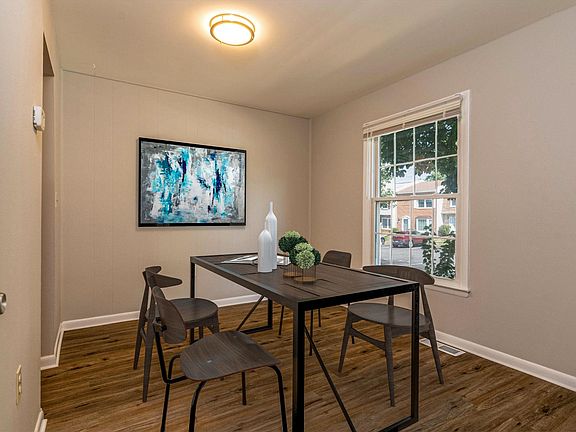 Staged dining room/den on main level of the home.