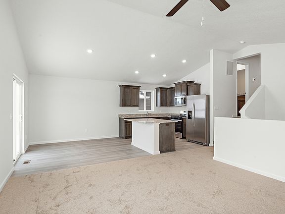 The entertainment space is open and including the dining room, kitchen, and family room