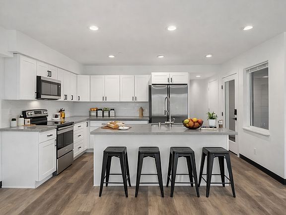 Kitchen comes furnished with barstools, pots, pans, cups, glasses, plated, utensils, small appliances, etc.