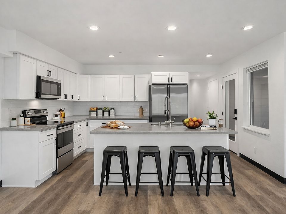 Kitchen comes furnished with barstools, pots, pans, cups, glasses, plated, utensils, small appliances, etc.