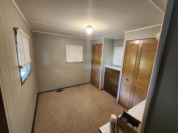 Bedroom. It's big enough for a queen bed with just enough space left to walk around. 2 built in closets and built in drawers.