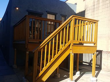 Large deck and private entrance for upstairs bedroom.
