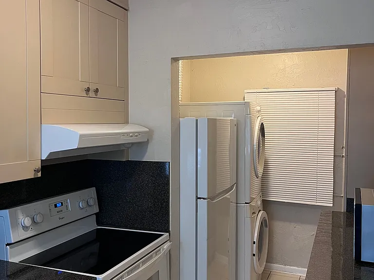 Glass top stove, refrigeratior, full size washer & dryer.