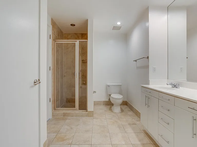 Stand-up showers with tile surrounds in select apartments