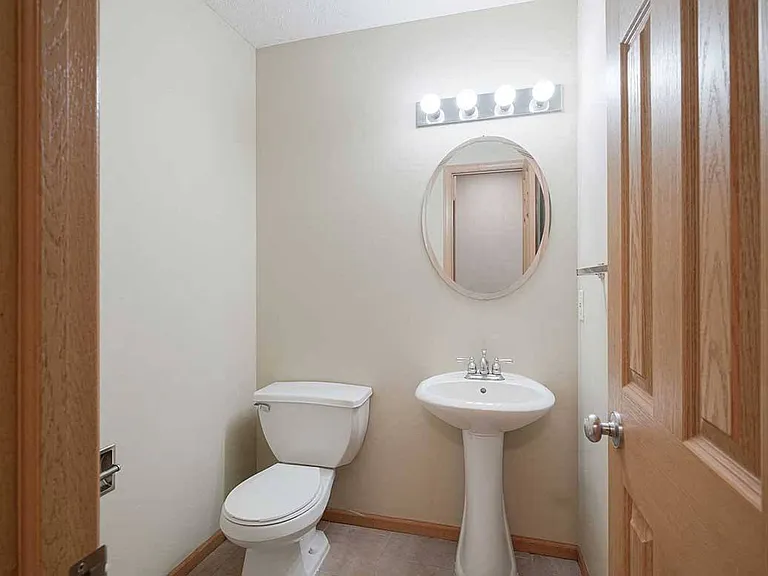 A half bath awaits on the main level of our duplexes, perfect for guests.