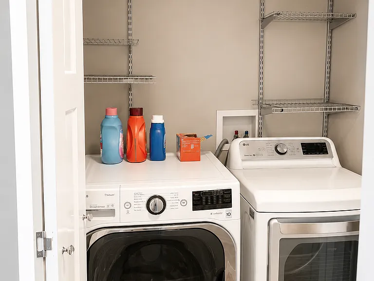 Full-size washer and dryer included in the unit.