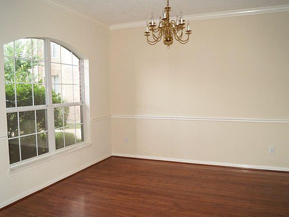 Pretty formal dining with crown molding and chair rail