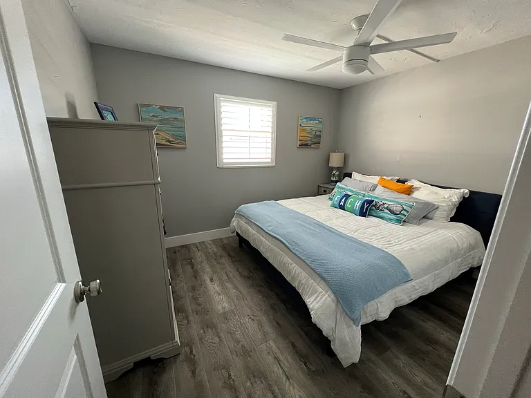 Guest bedroom with king size bed, full closet and oversized dresser