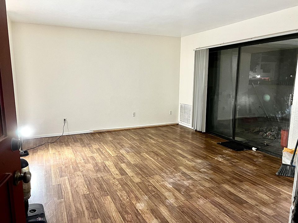 Large spacious Living area with sliding door opening to very spacious patio.