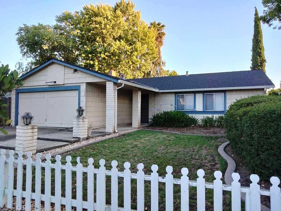 Front yard with lawn and fence