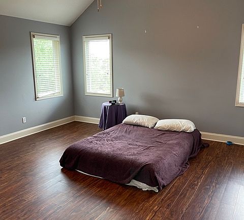 Master bedroom with ceiling fan.