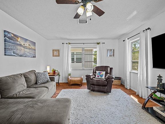 There is plenty of room for relaxing and entertaining in the spacious living area.