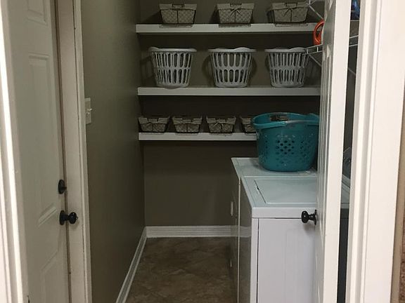 Laundry room with plenty of storage. Washer and dryer included.