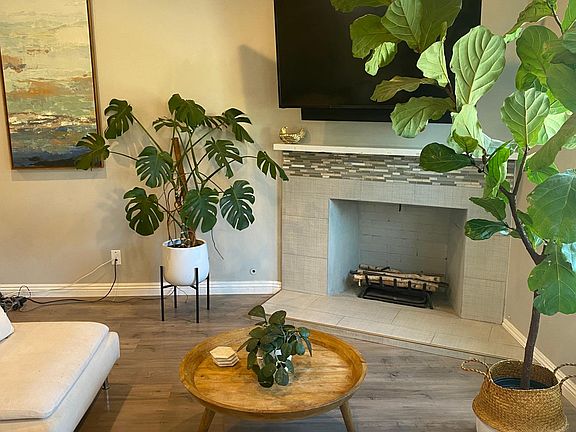 Large living room (other half not shown) with fireplace