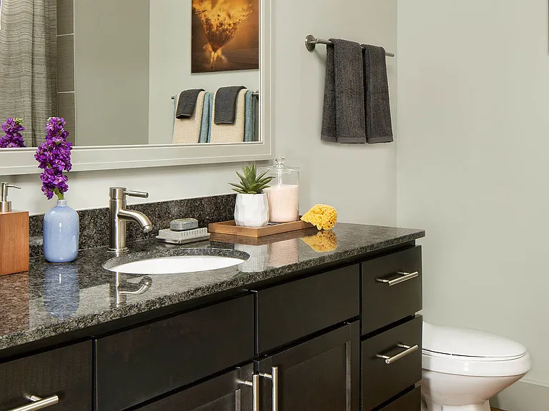 Apartment Bathroom with vanity sink.