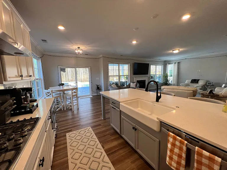 Galley kitchen with farmhouse porcelain sink