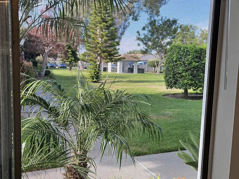 greem belt view from your front living room window. This complex has a massive greenbelt area, including picnic are. Nice pool close but not too close and club house. Like resort living!