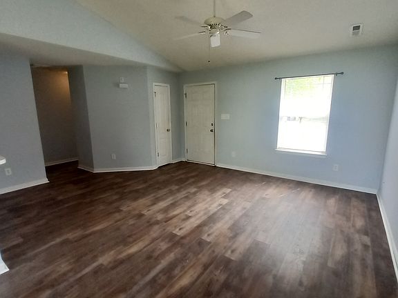 Living room from the dining area new plank flooring and paint.