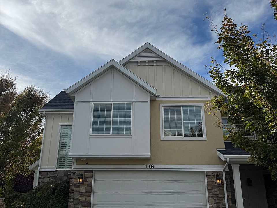 Front, corner townhome with grass space to the left.