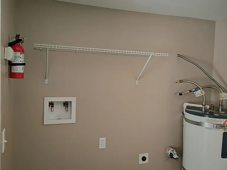 Laundry area with extra storage area