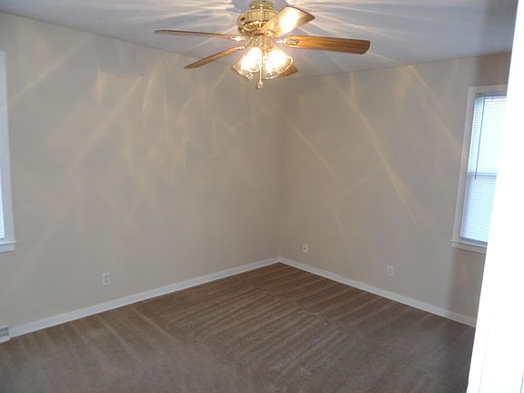 All bedrooms are painted a neutral tan with white trim