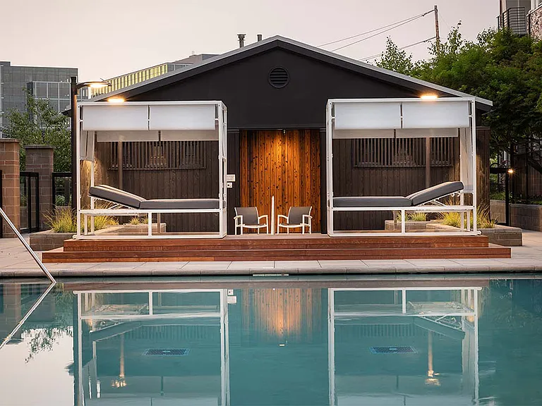 Apartment community resort style pool + cabanas at Griffis Lake Washington in Renton, Washington.