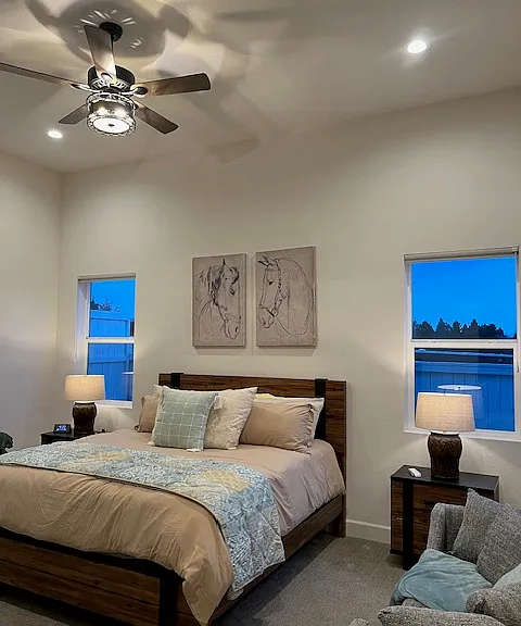 Primary bedroom with ceiling fan