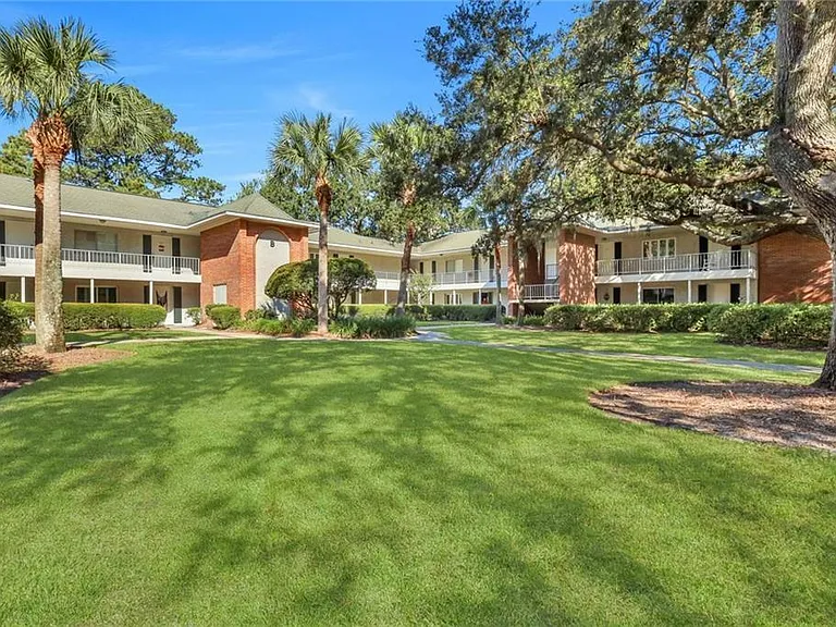 Beautiful property with center courtyard draped with oak trees