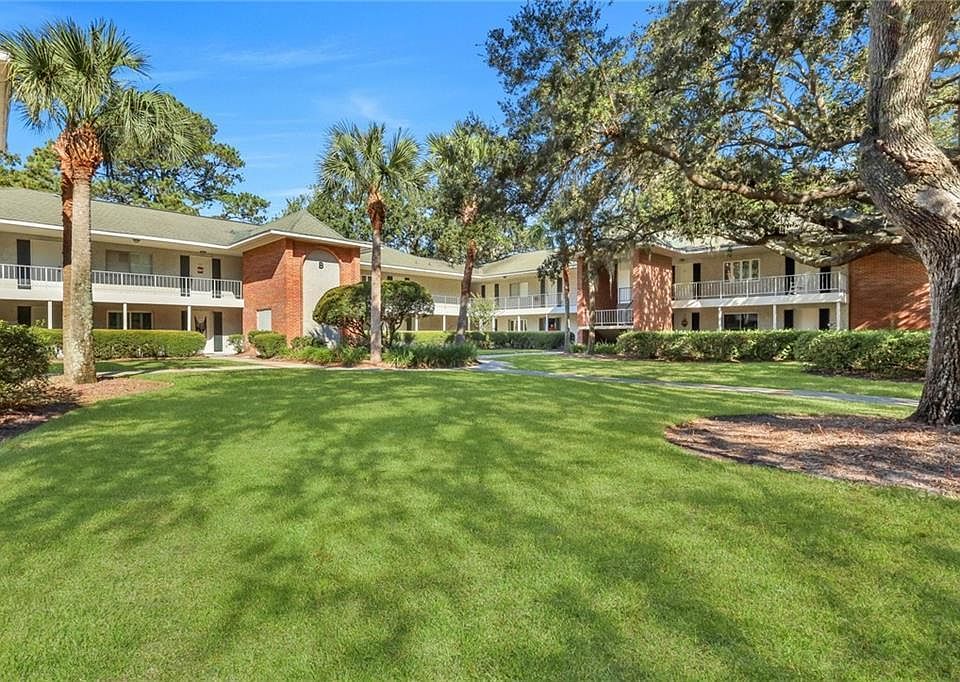 Beautiful property with center courtyard draped with oak trees