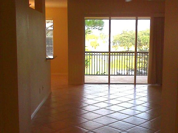 Living Room/Sliding doors to screened-in lanai/balcony