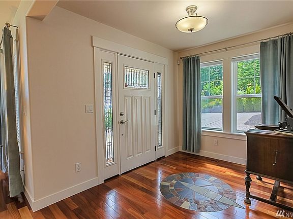 Entryway beckons you inside to hardwood floors with slate inlay