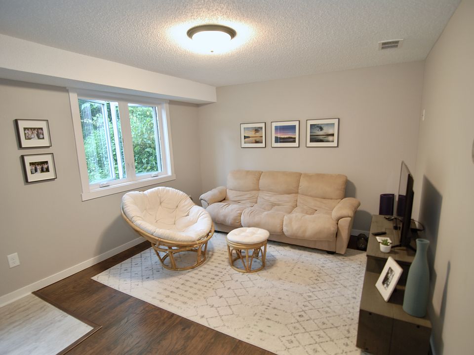 Family room with a large walk-in entry/storage closet.